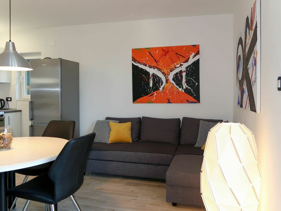 Room, Interior Design, Orange, Living Room, Furniture, Property, Yellow, Wall, Table, House
