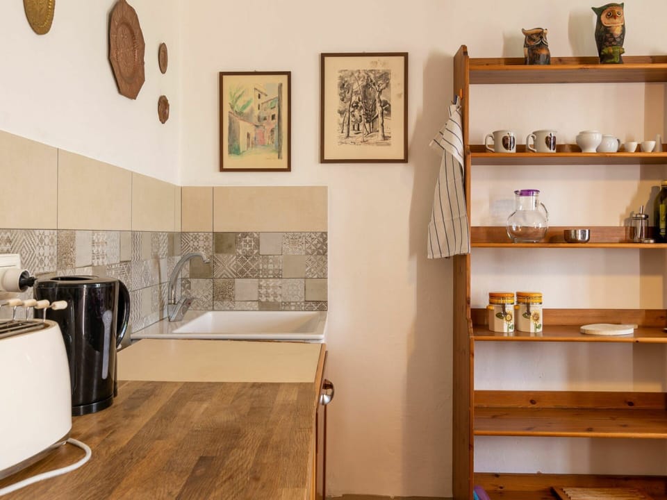 Brown, Property, Interior Design, Shelf, Wood, Picture Frame, Floor, Wall, Home Appliance, Flooring