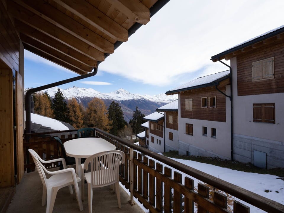 Sky, Property, Window, Furniture, Snow, Cloud, Building, Wood, Mountain, Porch