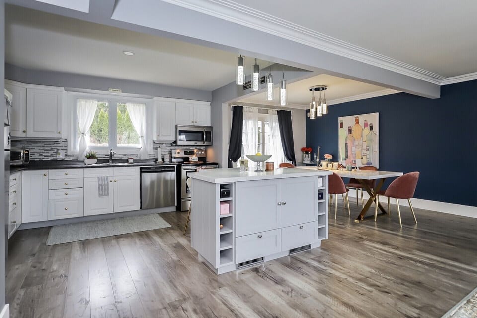 Open concept modern kitchen with views of the beautiful outdoor space