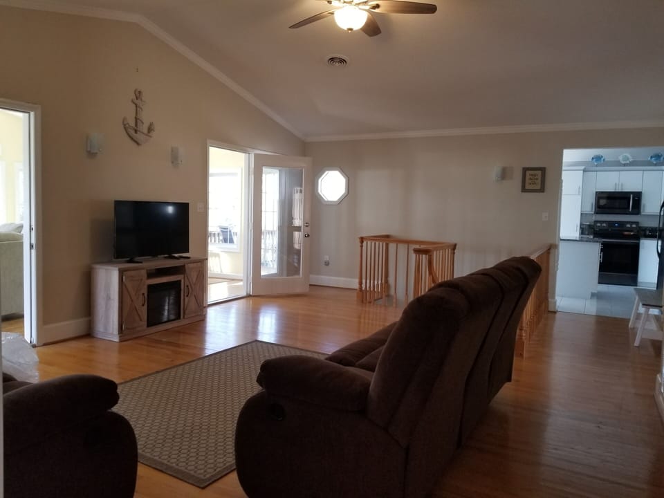 Family Room is central to the Sunroom, Kitchen, stairs and main Bedroom.