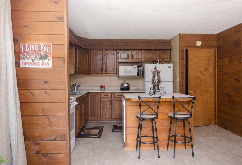 Kitchen with island with two stools