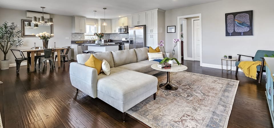 Open living room and dining room concept. Plus a mini split air conditioner to keep you warm or cool.