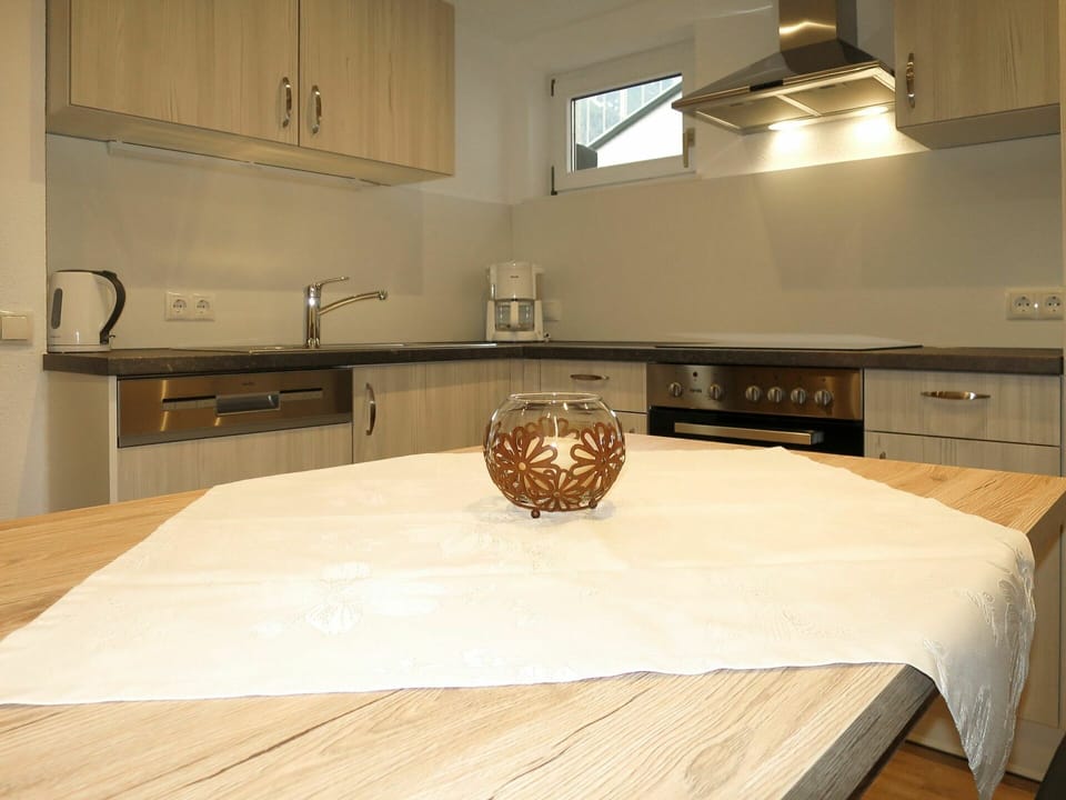 Table, Cabinetry, Furniture, Property, Countertop, Building, Wood, Kitchen, Lighting, Flooring