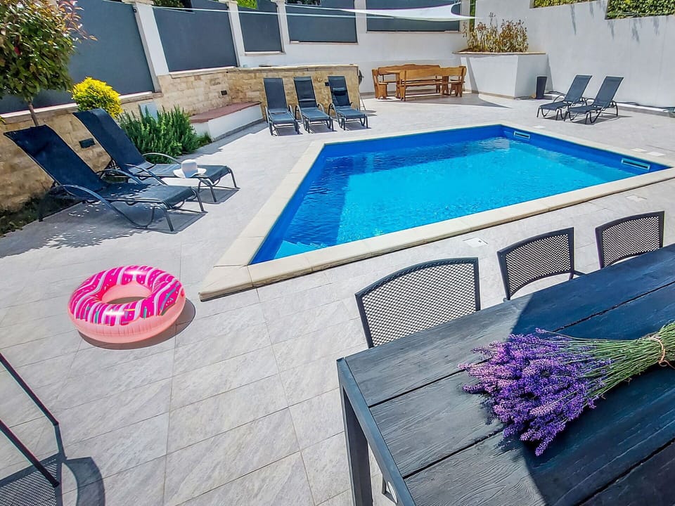 Swimming Pool, Outdoor Furniture, Furniture, Resort, Chair, Sunlounger, Flooring, Composite Material, Floor, Umbrella