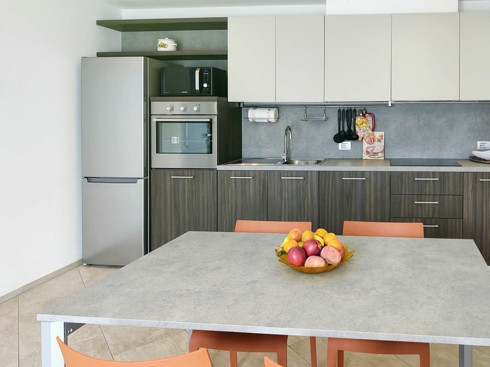 Cabinetry, Countertop, Table, Property, Furniture, Food, Tableware, Kitchen Stove, Kitchen, Kitchen Appliance