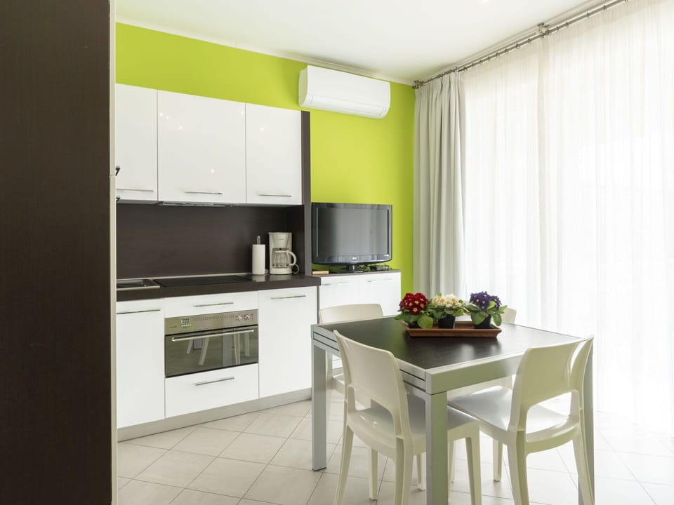Cabinetry, Furniture, Property, Countertop, Building, Table, Kitchen Stove, Houseplant, Interior Design, Chair