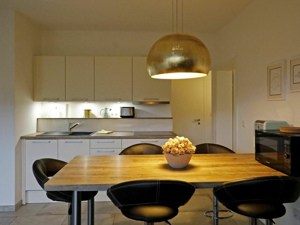 Table, Property, Furniture, Cabinetry, Countertop, Wood, Kitchen, Chair, Lighting, Interior Design