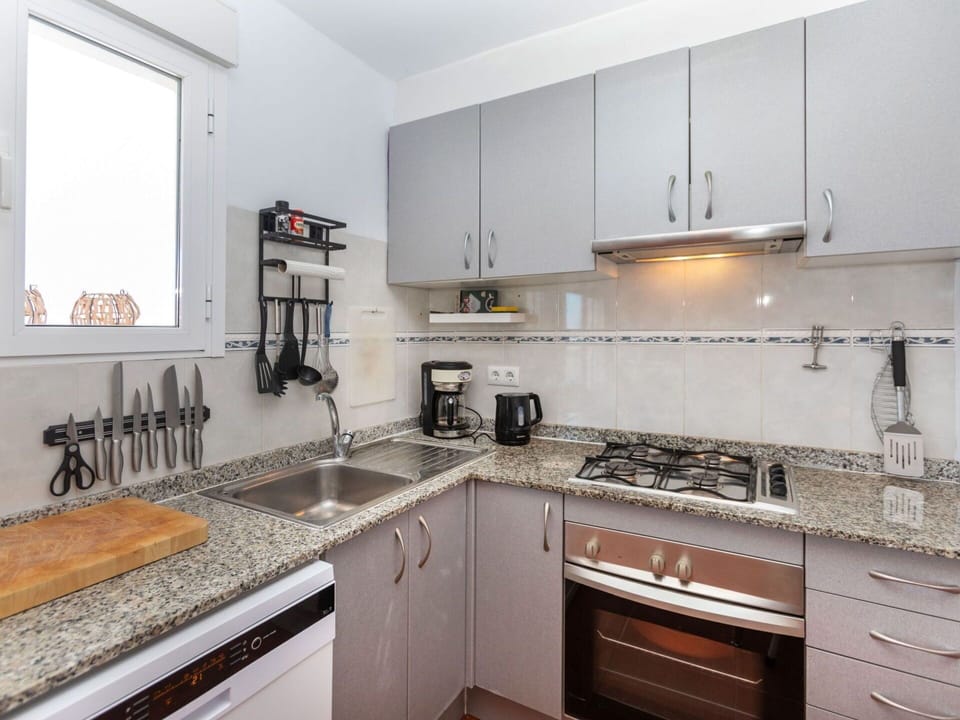 Cabinetry, Property, Countertop, Kitchen Sink, Sink, Window, Kitchen Stove, Kitchen, Interior Design, Kitchen Appliance