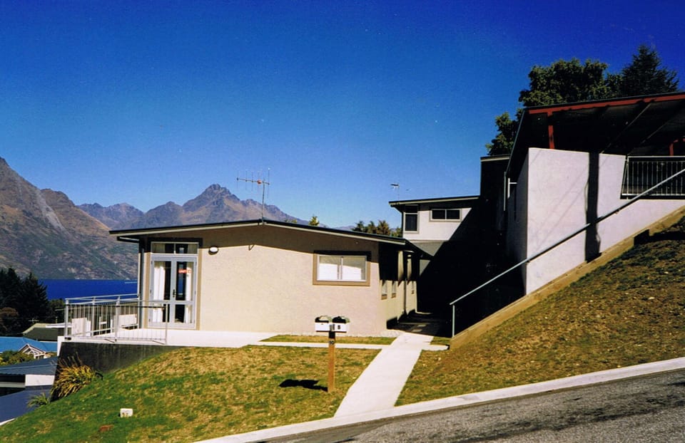 Unit from road. Carport up stairway.