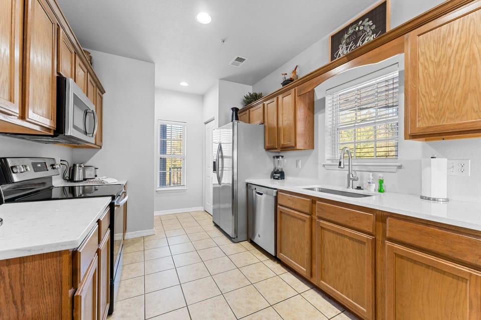 Large windows provide a bright kitchen.