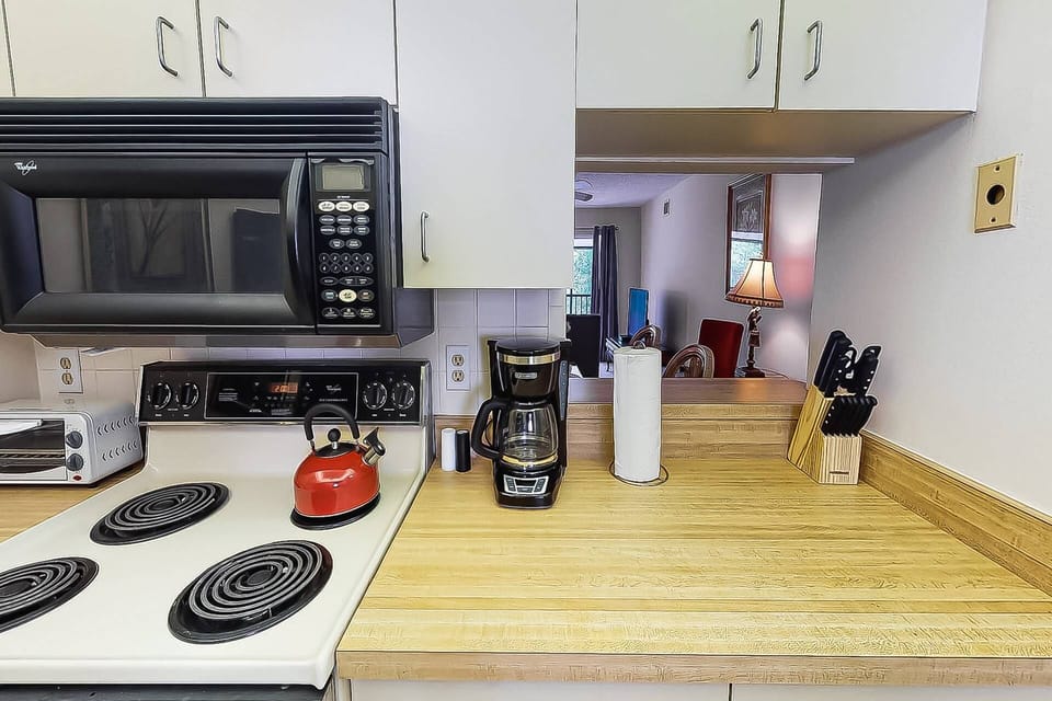 Kitchen is basic with a pass thru to the dining area.  Makes setting the table a breeze!