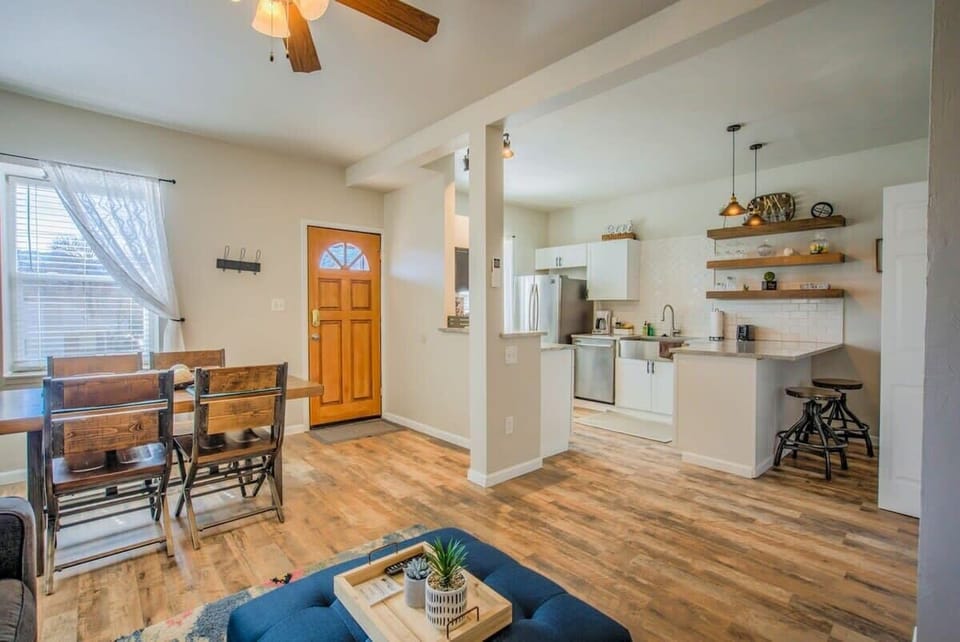 Cook, eat, and linger together in the open kitchen and dining space, with room to spread out and relax between plans.