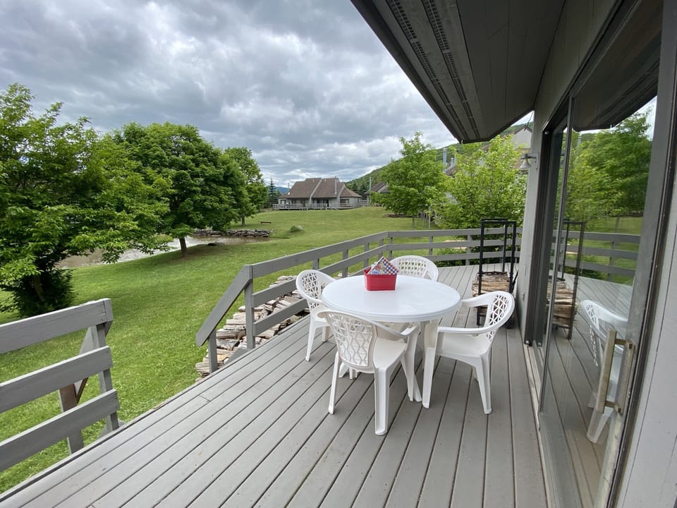 Outdoor deck.
With grill
Steps to pool/hot tub and club house.