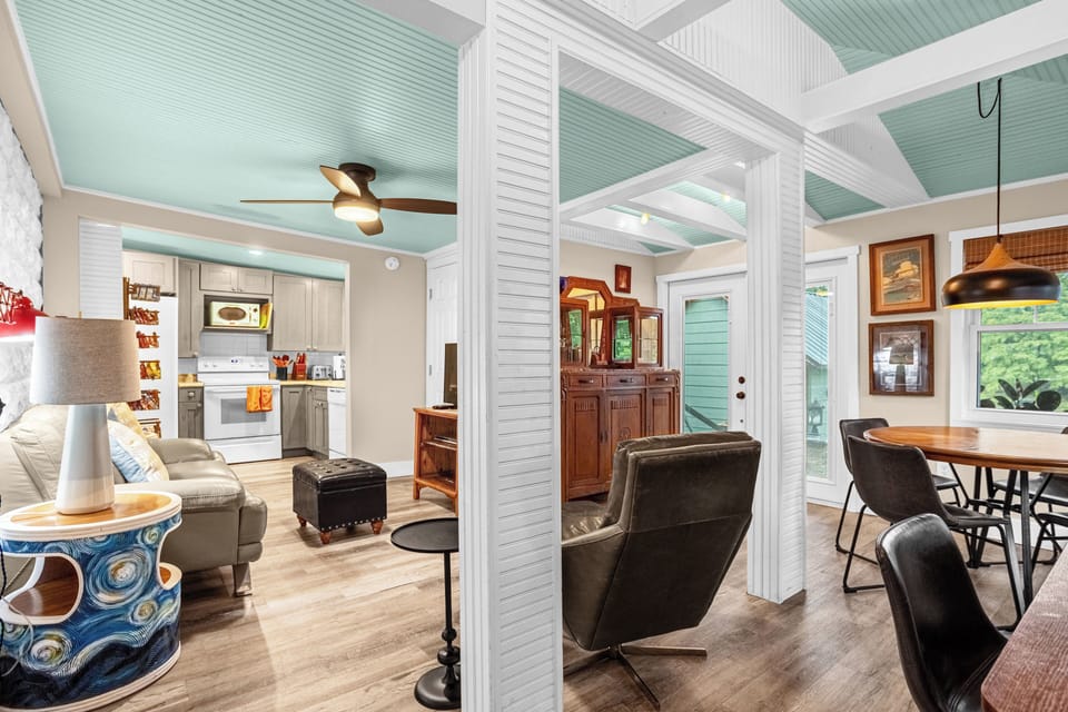 Family room with flat screen TV and work station.