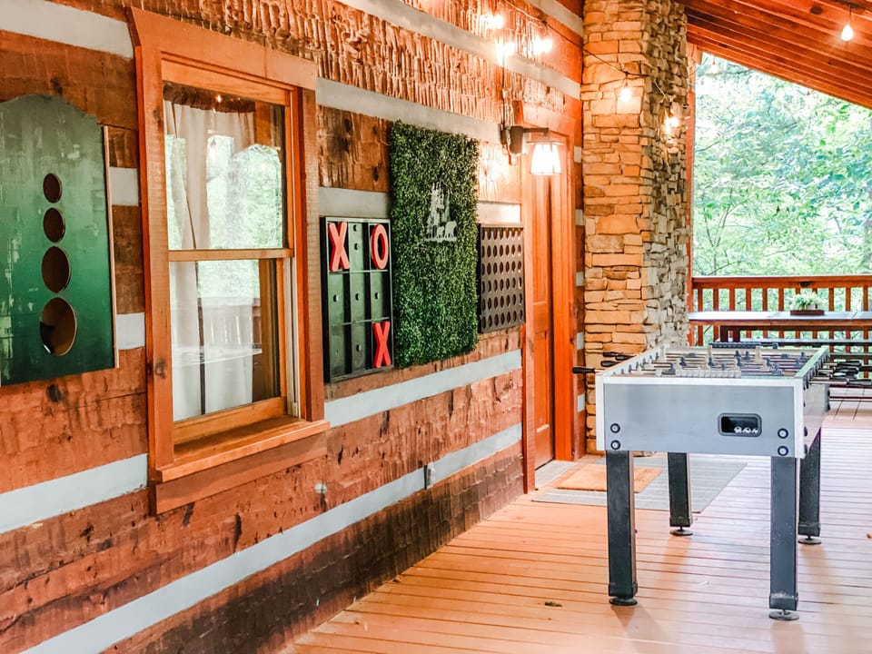 Outdoor game area.  Enjoy foosball, bean bag toss, tic tac toe and connect four!