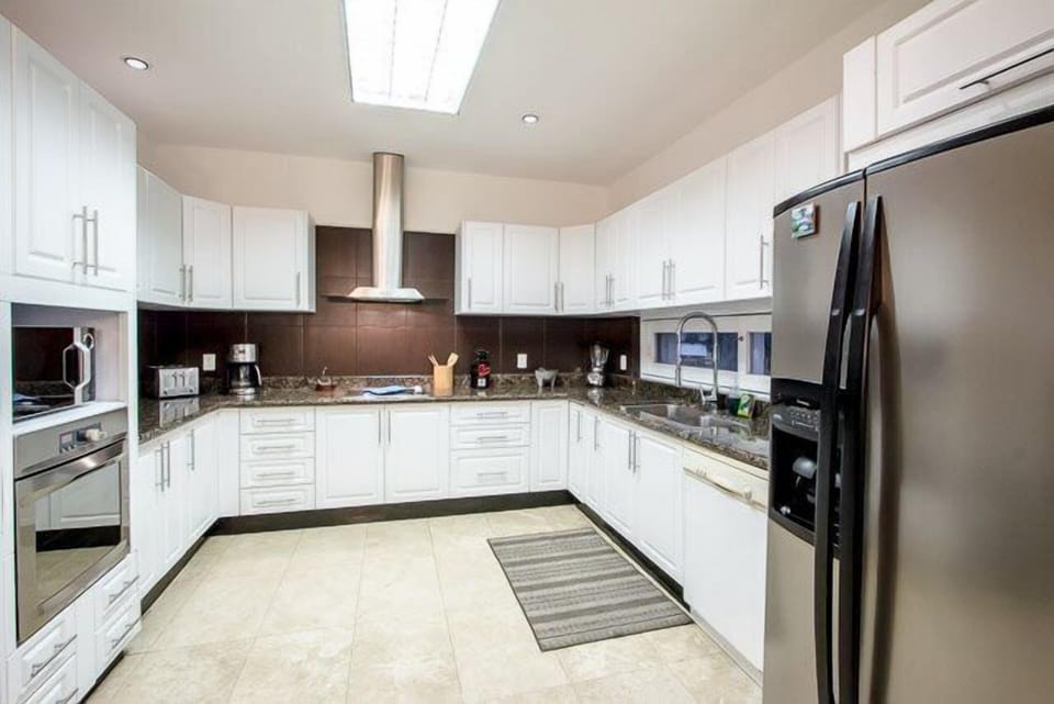 Kitchen is huge and fully equipped. It even has a side by side refrigerator.