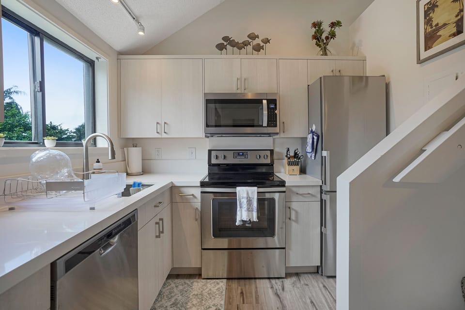Prepare meals in the bright kitchen with stainless steel appliances and everything within easy reach.