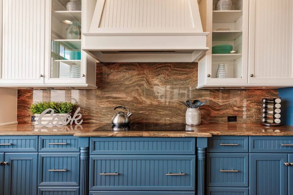 Chef’s kitchen with artisan cabinetry and luxe stone countertops
