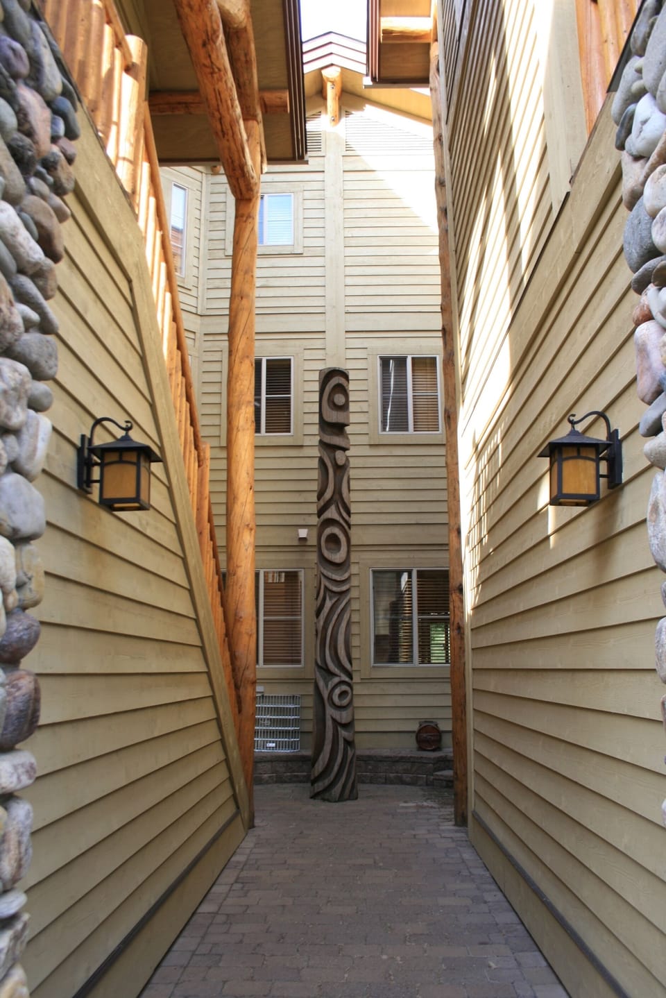The passageway to our stairs (on left) with a totem pole.