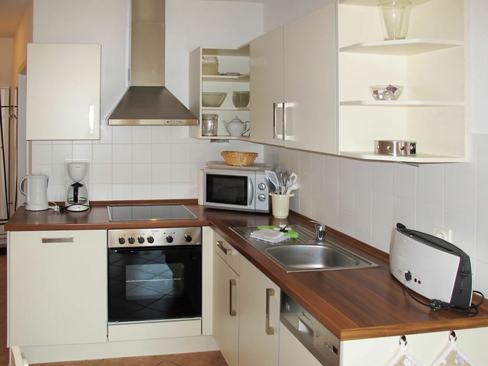 Countertop, Room, Furniture, Kitchen, Cabinetry, Property, Kitchen Stove, Interior Design, Building, Floor