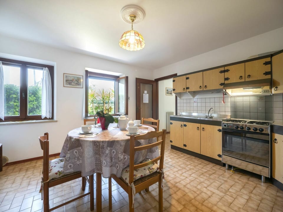 Furniture, Cabinetry, Table, Countertop, Window, Chair, Interior Design, Wood, Lighting, Kitchen