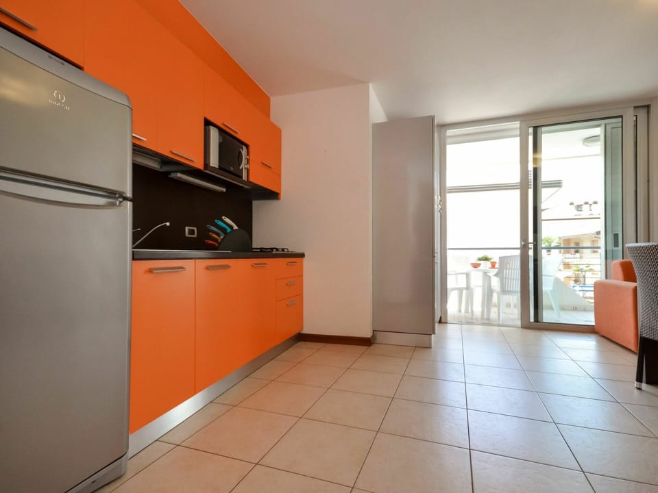 Cabinetry, Building, Window, Wood, Interior Design, Orange, Kitchen Stove, Kitchen Appliance, Countertop