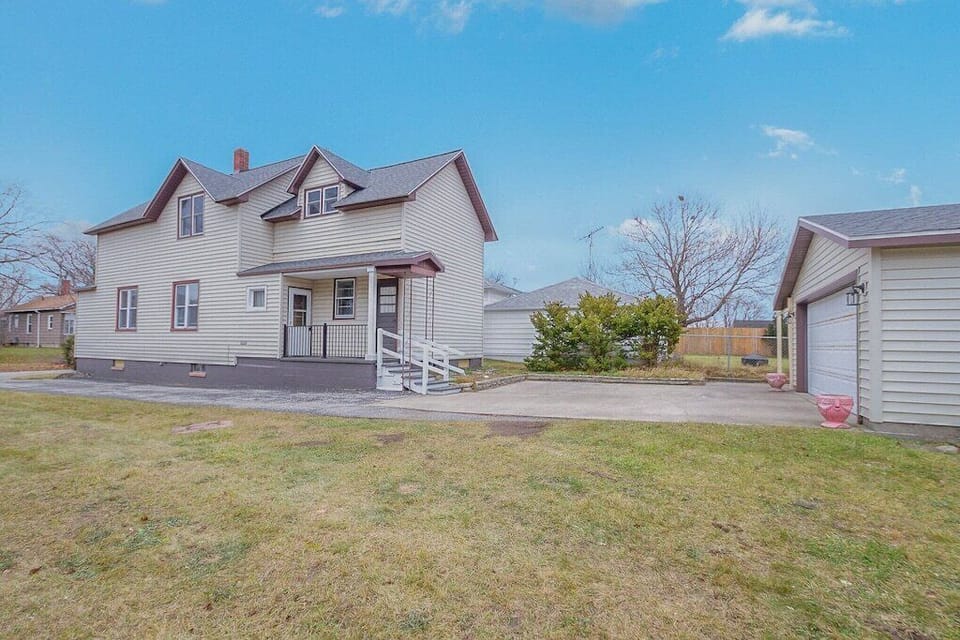 Driveway along house with parking in the back