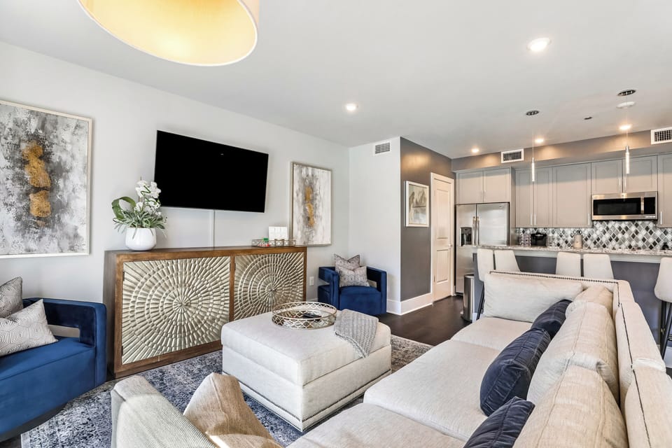 Open concept living, kitchen, and dining with ample seating. 58” Samsung Smart 4K TV for streaming and DIRECTV Entertainment. Relax on the sofa or cozy chairs after a day in NOLA! Dining for six, plus four at the bar. Plenty of natural light!