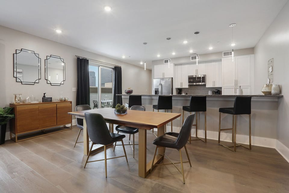 Cook and dine easily in the fully stocked kitchen, equipped with all stainless steel appliances, gas range, basic cookware, and a dining area for a comfortable meal at home. Entertain at the bar with seating for four.