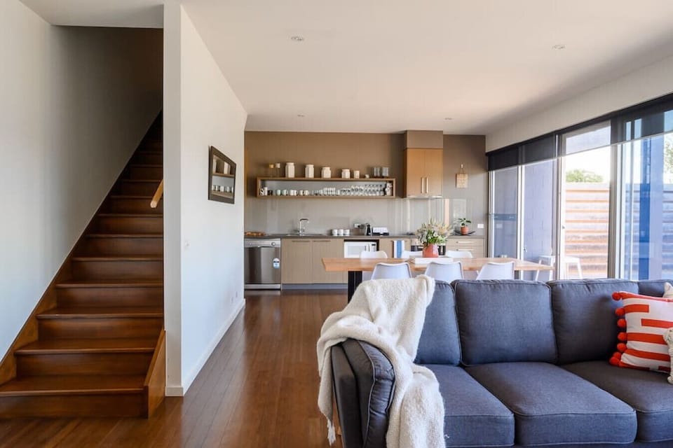 [Stairs] Head upstairs to access two bedrooms and look at the views! The climb worth it.