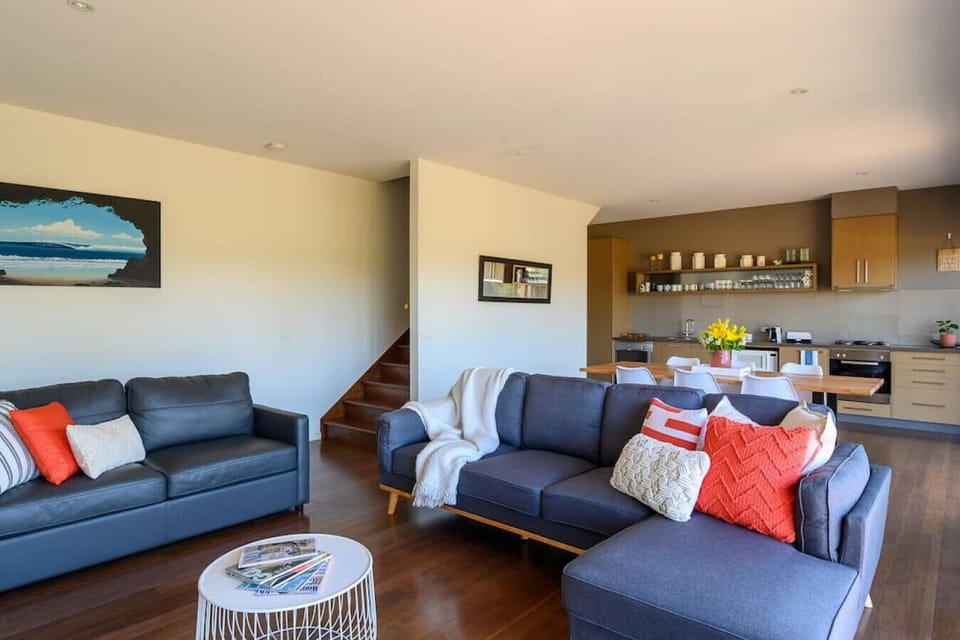 [Living Room] An open-plan living/lounge that opens onto the kitchen.