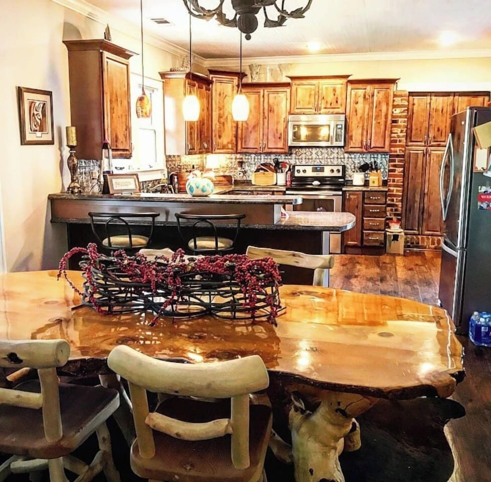 Dining room looking into kitchen. Table seating for 4 with 2 bar seats! 
