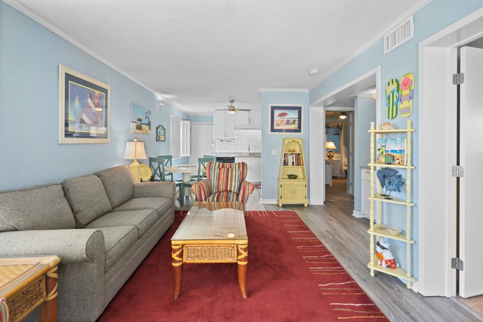 Relax in your bright, open living space with cozy sectional seating and charming coastal decor that makes you feel right at home.