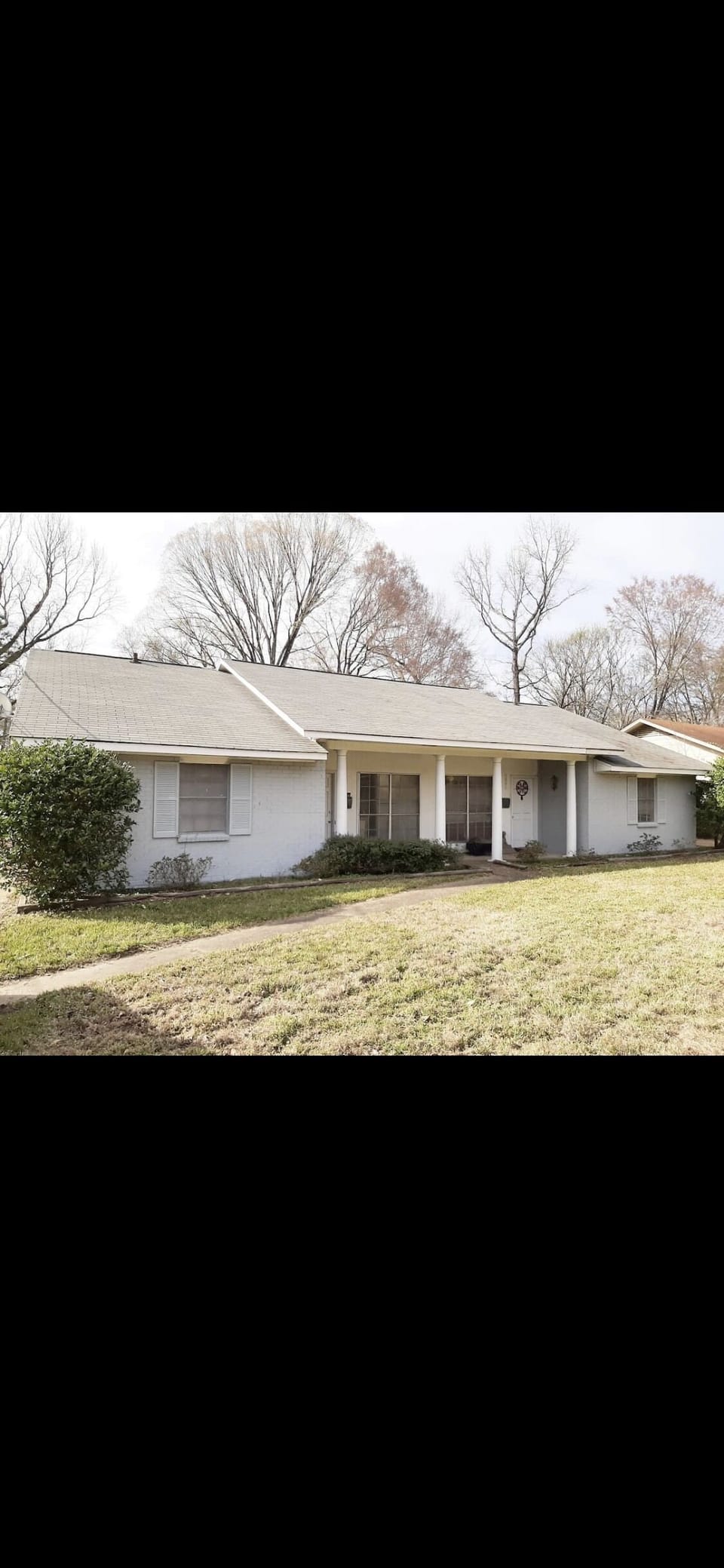 Front of duplex condo with large porch for all your delivery 