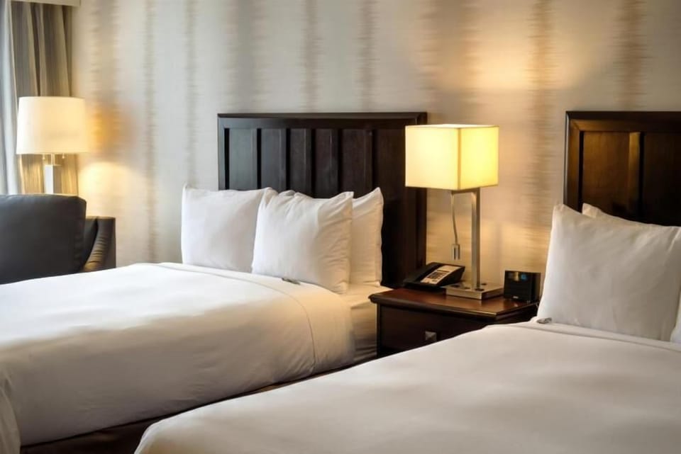 Unit with 2 comfy Double beds. Interior and views may vary based on location and availability.