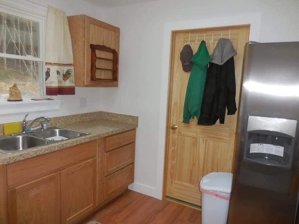 complete kitchen fully equipped with pots pans dishes microwave new stove refrig