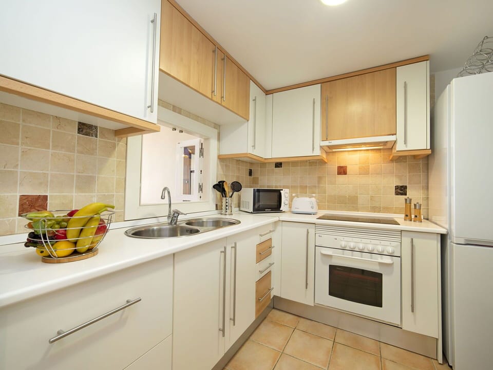 Countertop, Property, Room, Kitchen, Cabinetry, Furniture, Yellow, Interior Design, Building, Real Estate