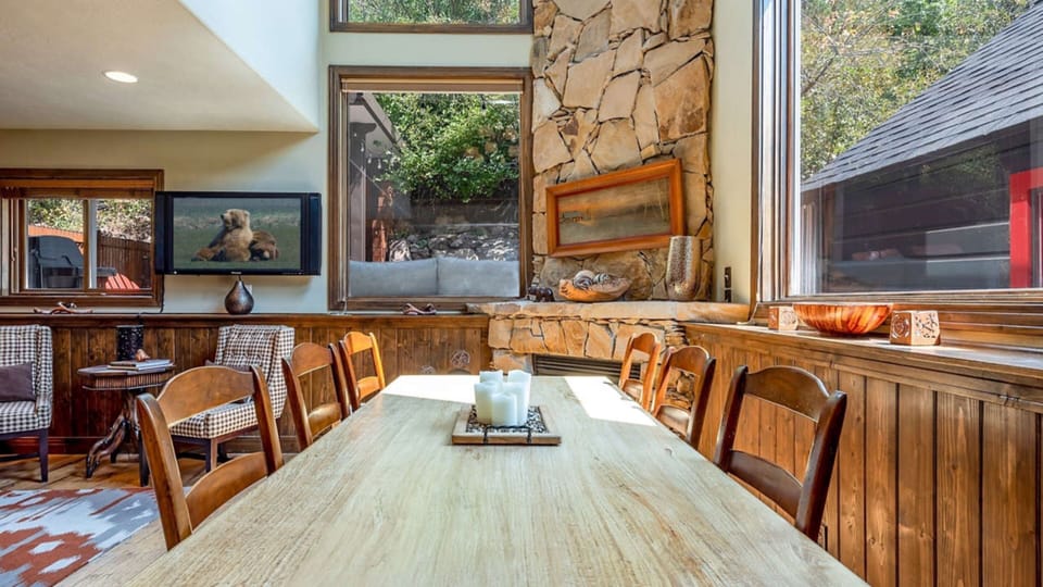 Rustic wood and a beautiful stone fireplace make this cabin warm and cozy.