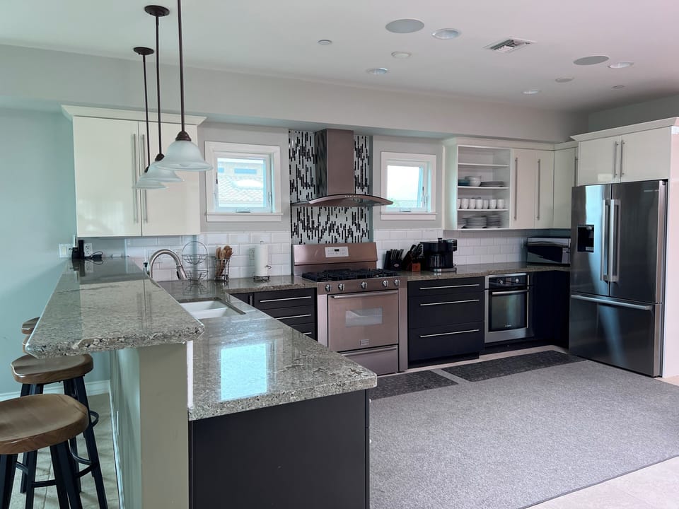 Full kitchen and well stocked pantry, second floor that connects to dining area