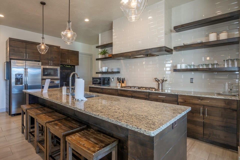 Enjoy a large kitchen stocked with appliances and utensils for cooking