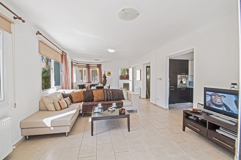 Living room with corner sofa and widescreen TV