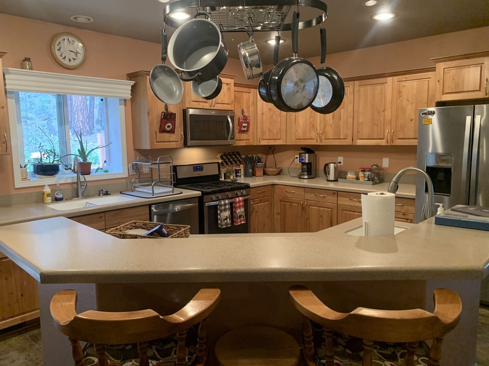 Island bar in kitchen. Great place to relax with coffee and conversation.