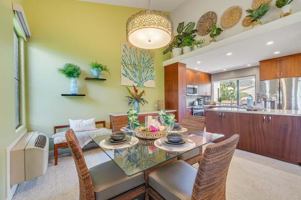 Art and baskets climb the walls, kitchens opening wide with wood and steel.