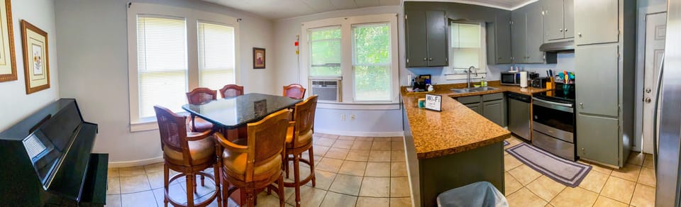 Large Kitchen and Dining Area. Plenty of Natural Light. Full Sized Piano!