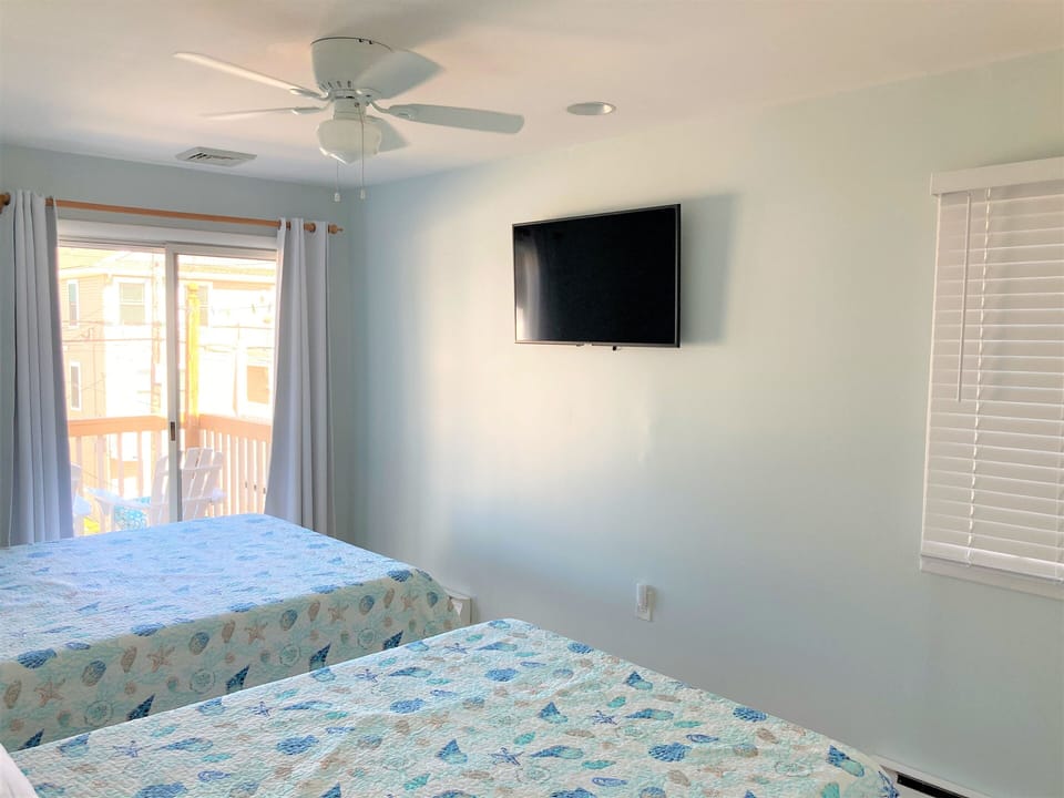 Bedroom 2 - Queen Bed & Full Bed w/ Smart TV. Sliding Door to Back Deck.