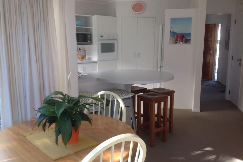 Small Dining table. Barstools  spacious well equipped Kitchen  