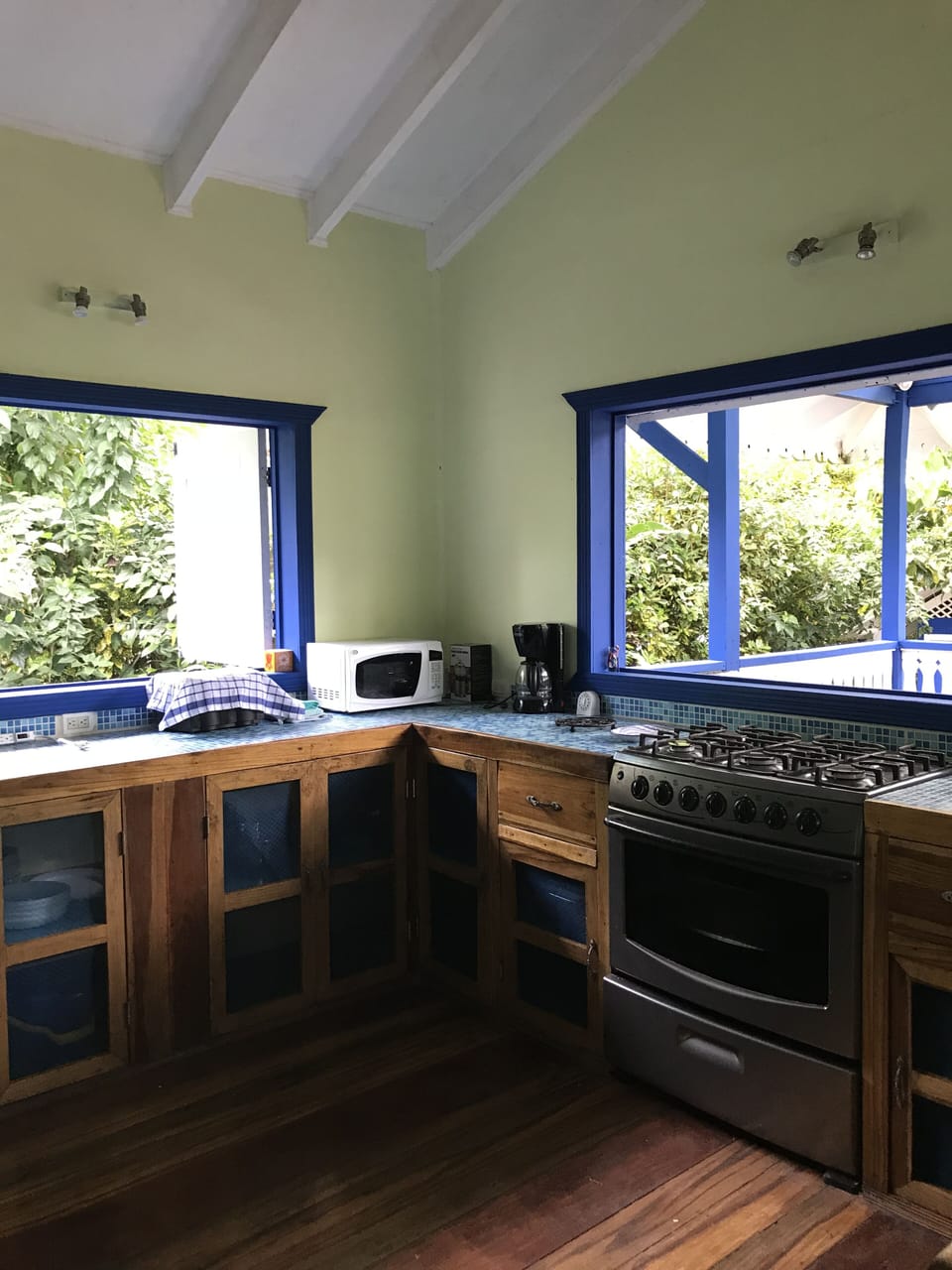 Kitchen is ready for you to cook and see the gardens while you food prep