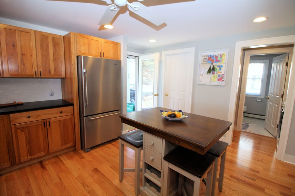 Kitchen has stainless appliances and custom counter tops