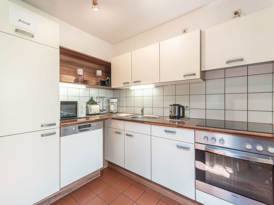 Countertop, Cabinetry, Furniture, Building, Kitchen Stove, Kitchen Appliance, Kitchen, Home Appliance, Wood, Stove